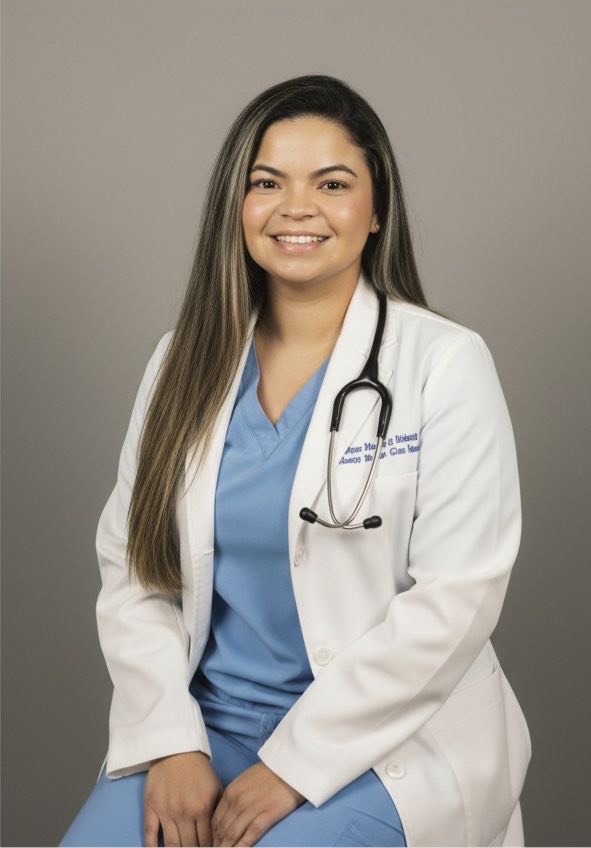 Smiling female doctor in white coat with stethoscope