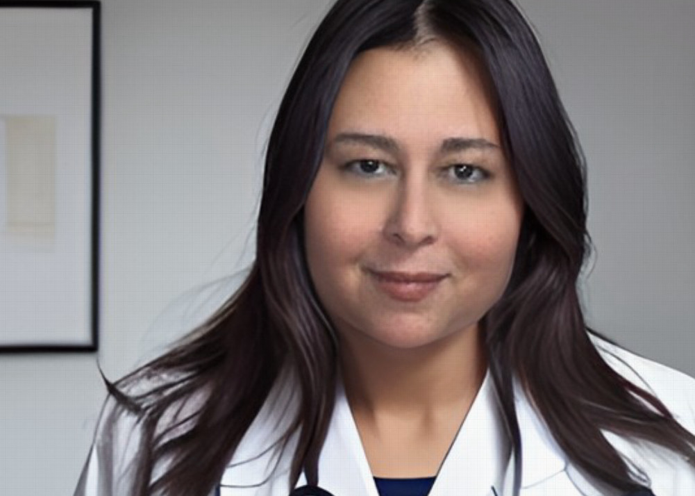 Smiling doctor with stethoscope and white coat
